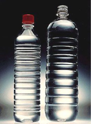 Clarified PP bottle for water (left) is a cost-effective alternative to adjacent PET bottle. 